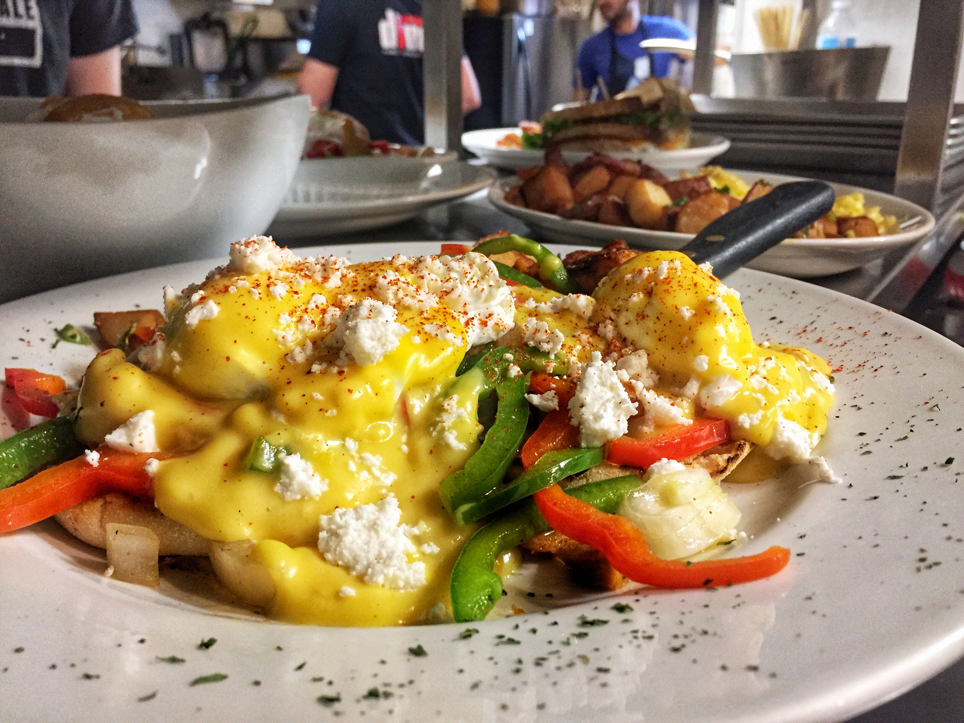 Eggs Benny with peppers, hollandaise, and homies at The Wellington Diner.