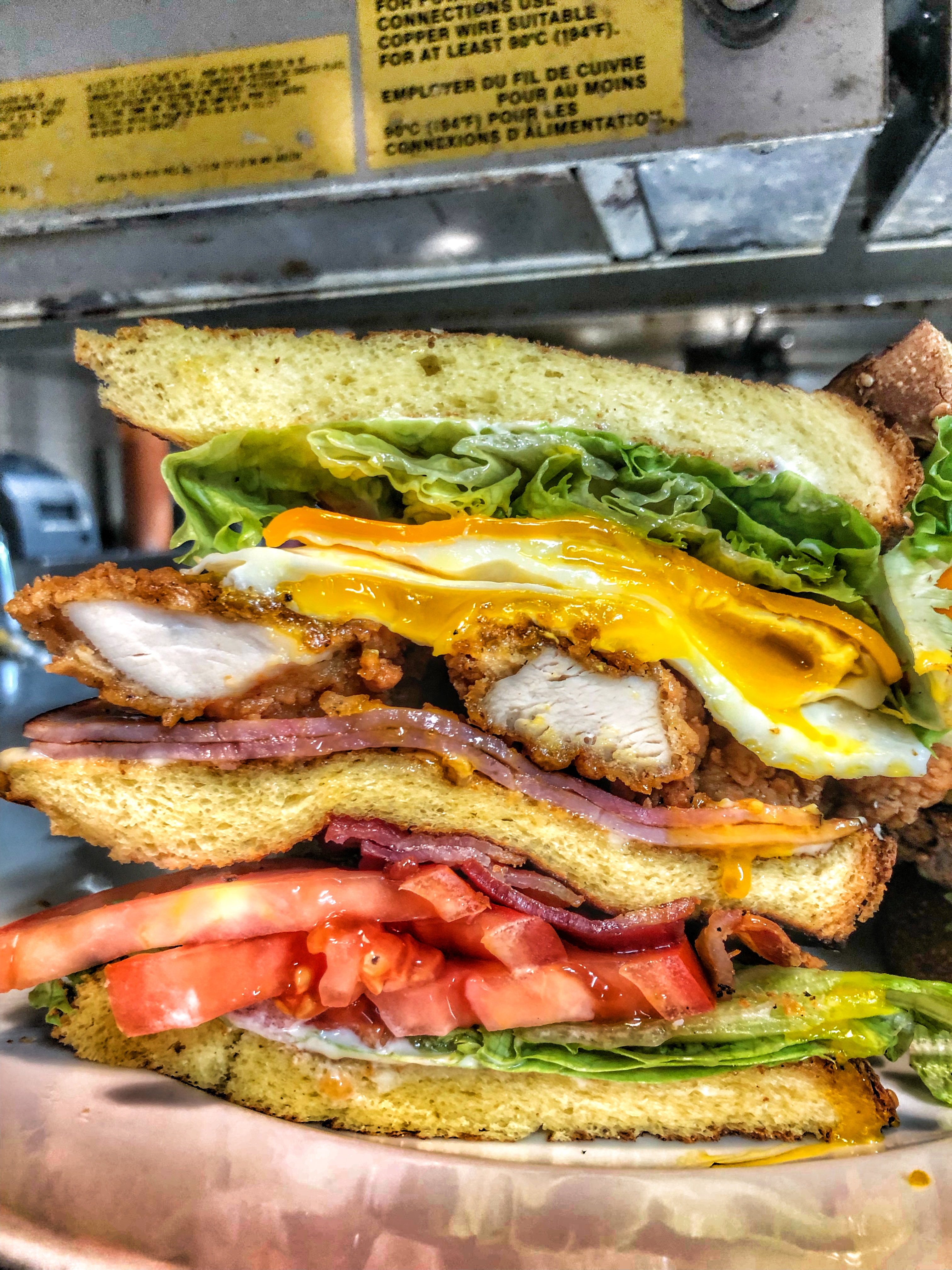 A stacked club sandwich at The Wellington Diner.